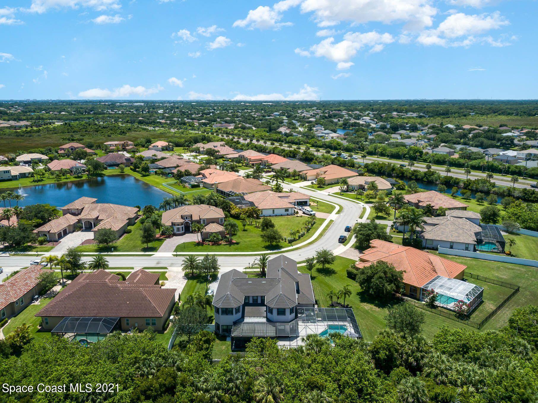 4175 Waterloo Place Melbourne, FL 32940 - Photo 4 of 49 an aerial view of residential houses with outdoor space