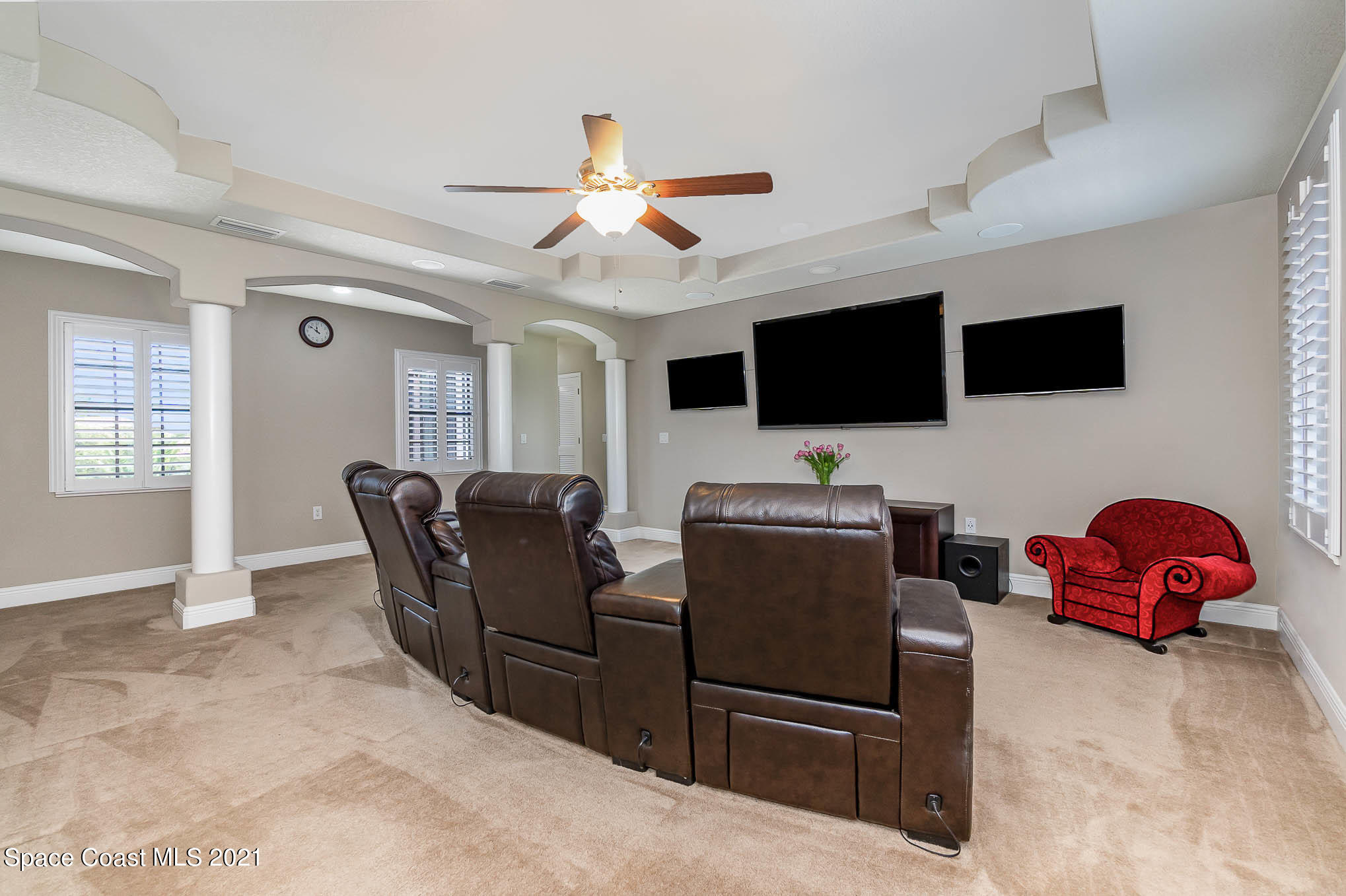 4175 Waterloo Place Melbourne, FL 32940 - Photo 39 of 49 a view of a livingroom with furniture and a flat screen tv