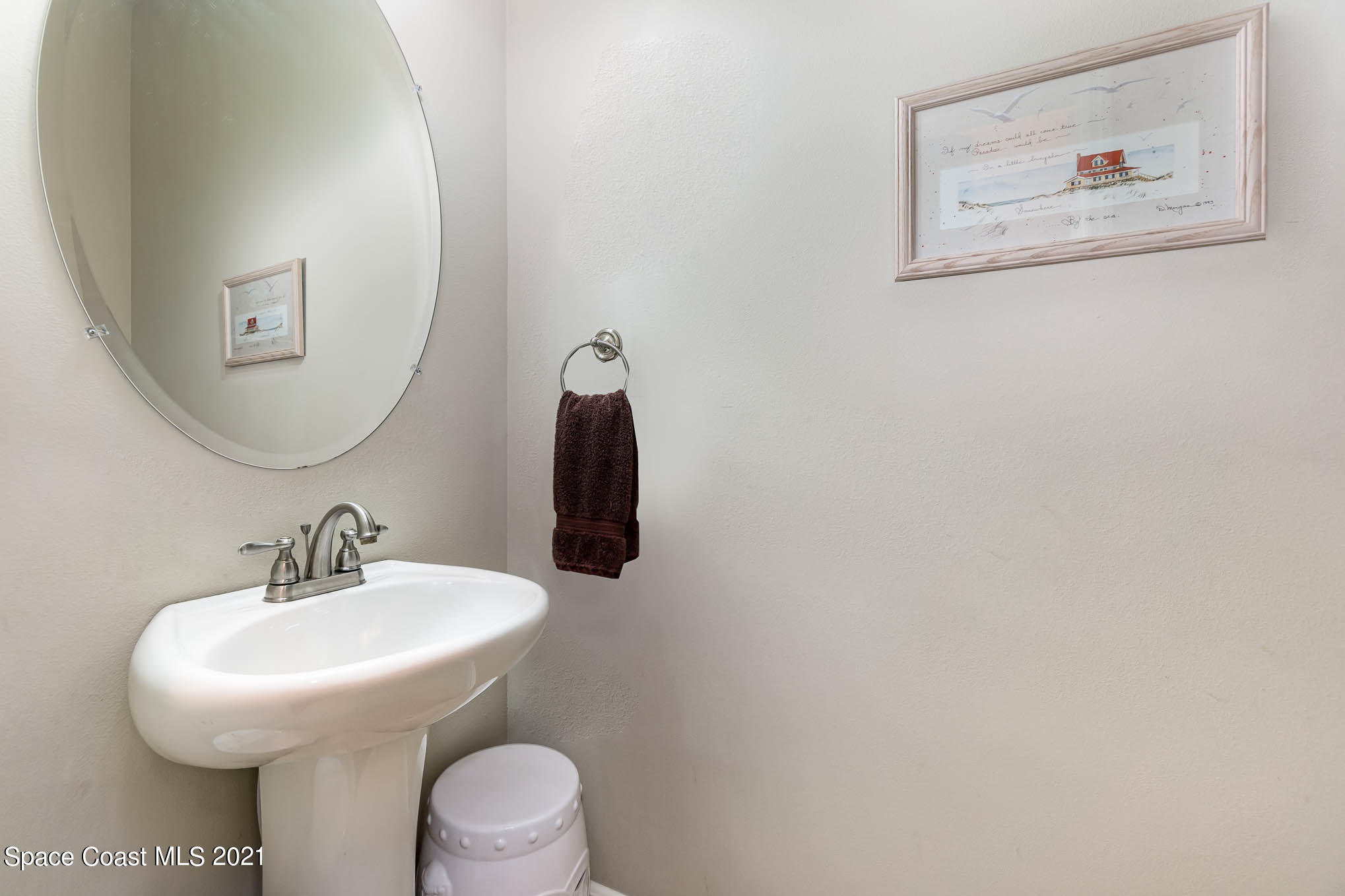 4175 Waterloo Place Melbourne, FL 32940 - Photo 42 of 49 a bathroom with a toilet and a sink