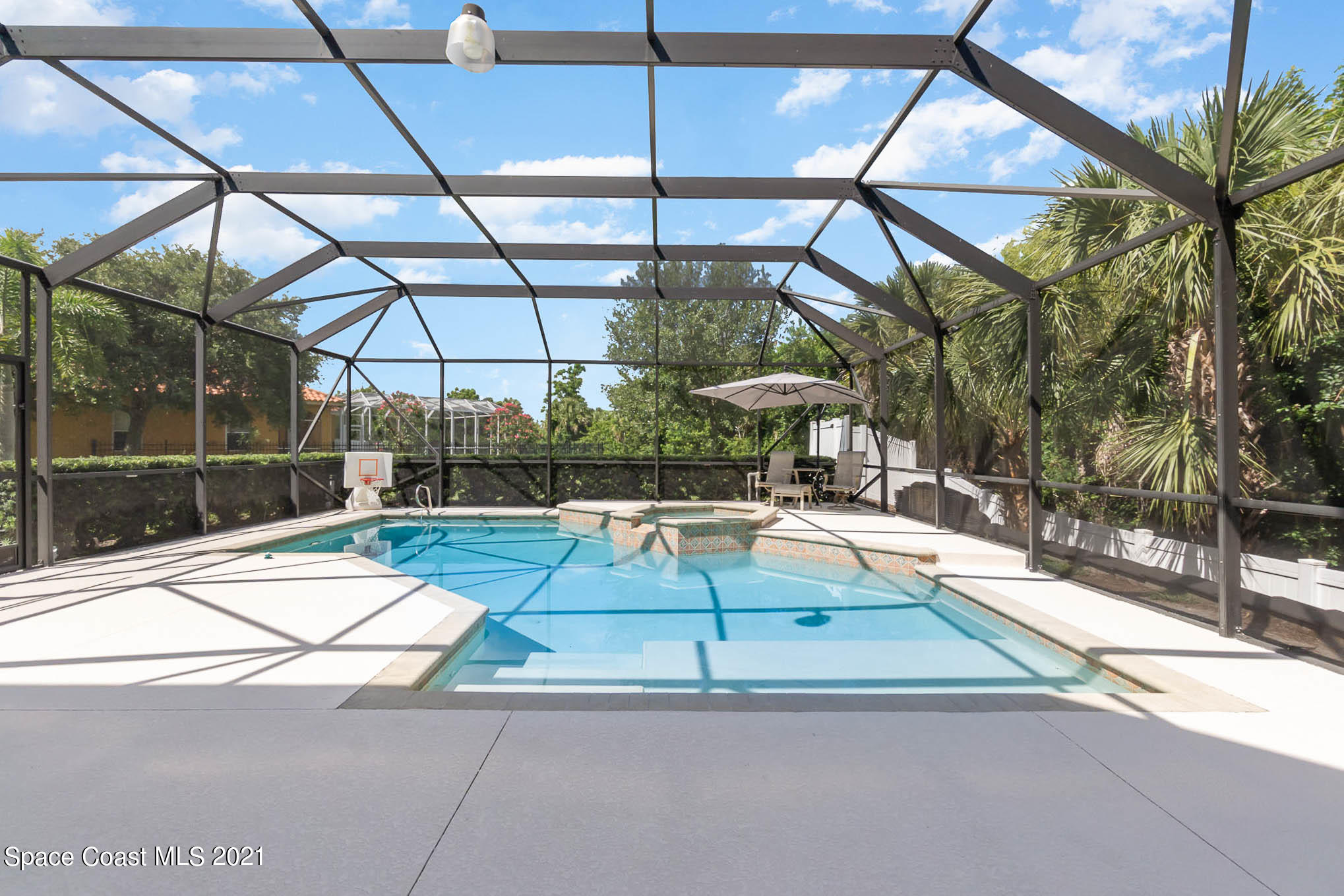 4175 Waterloo Place Melbourne, FL 32940 - Photo 46 of 49 a view of yard with a patio and glass door