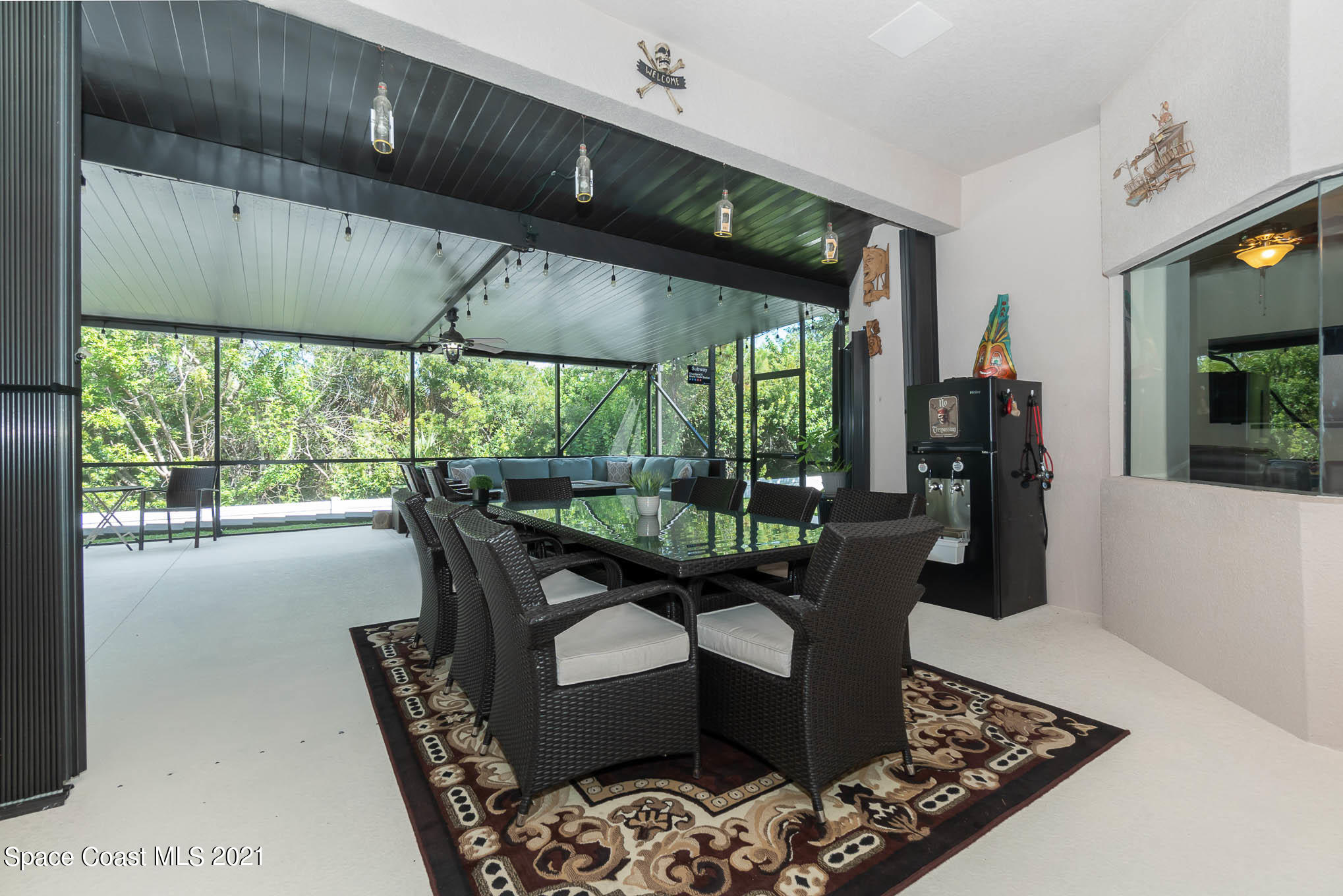 4175 Waterloo Place Melbourne, FL 32940 - Photo 47 of 49 a living room with furniture and large windows