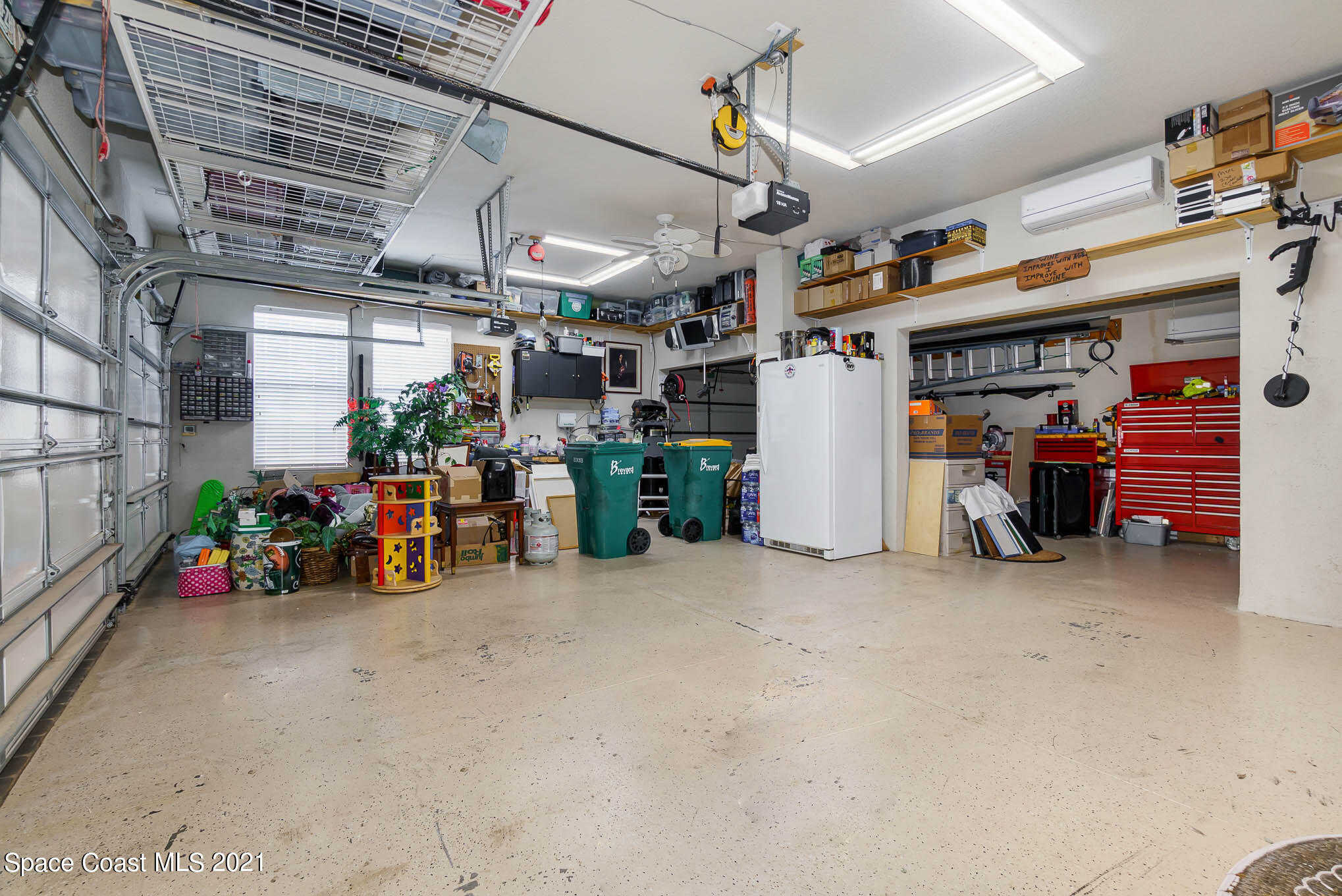 4175 Waterloo Place Melbourne, FL 32940 - Photo 49 of 49 a view of a storage room with a lot of stuff