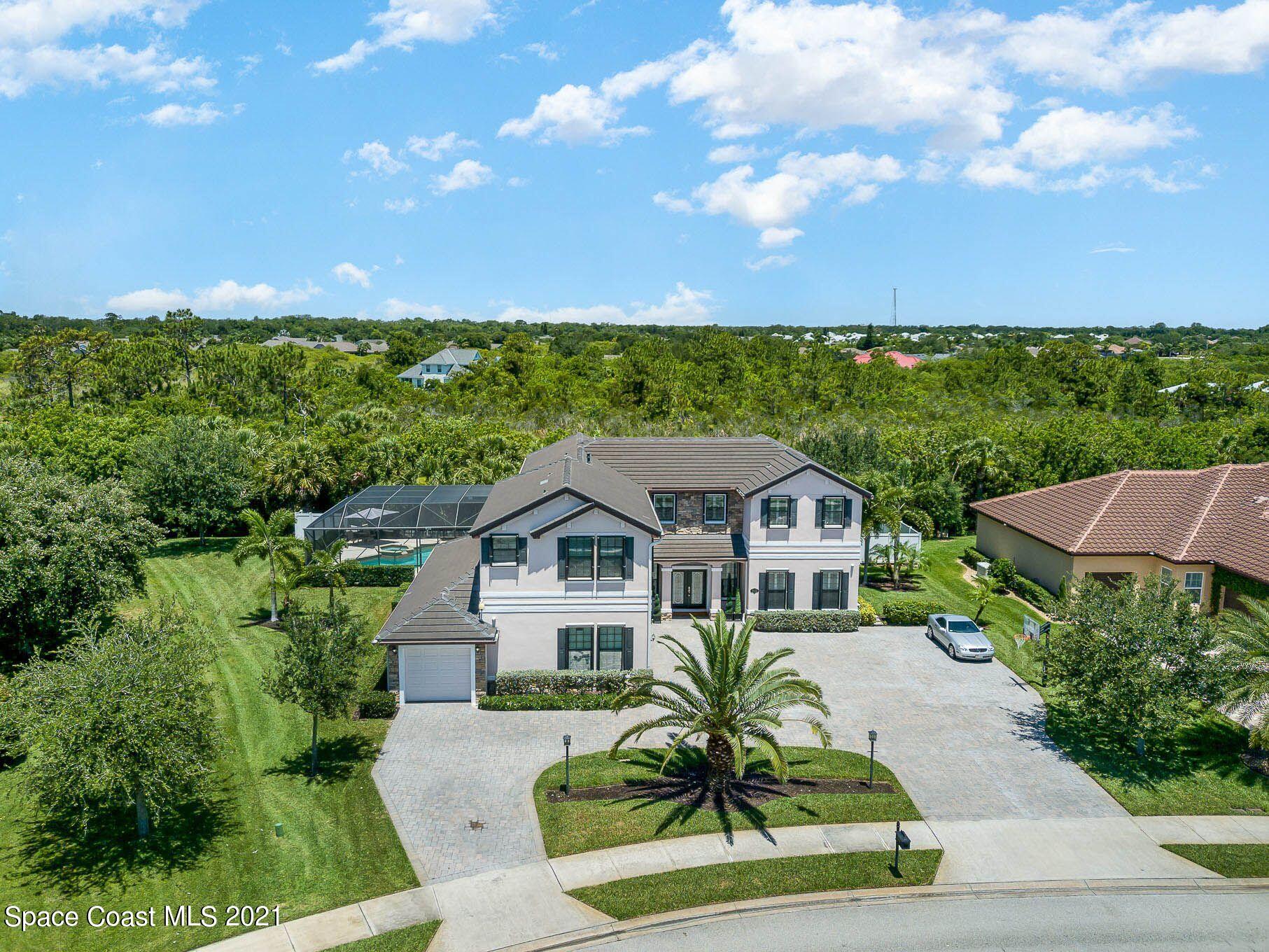 4175 Waterloo Place Melbourne, FL 32940 - Photo 6 of 49 a front view of a house with a yard