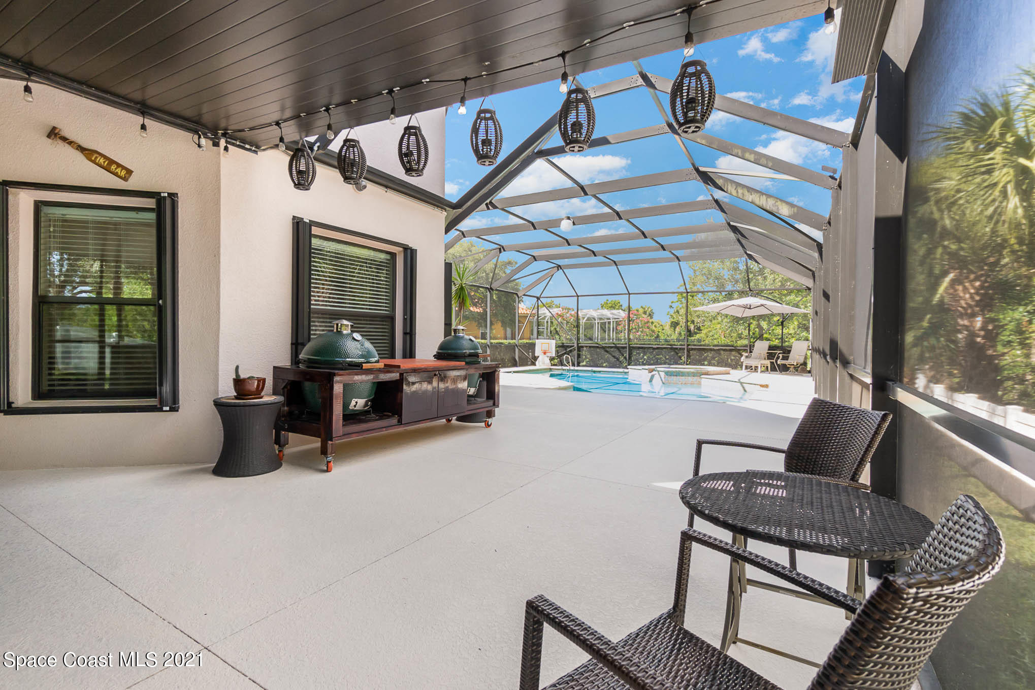 4175 Waterloo Place Melbourne, FL 32940 - Photo 9 of 49 a living room with furniture and a floor to ceiling window