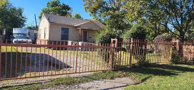 a view of a wrought iron fences in front of house