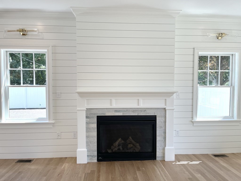18 Libby Avenue Reading, MA 01867 - Photo 16 of 23 a living room with a fireplace