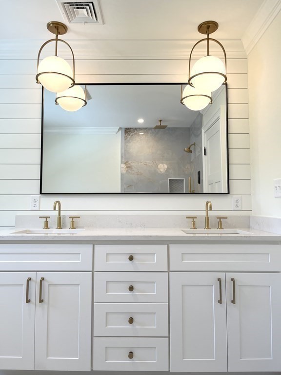 18 Libby Avenue Reading, MA 01867 - Photo 22 of 23 a bathroom with a sink and a mirror