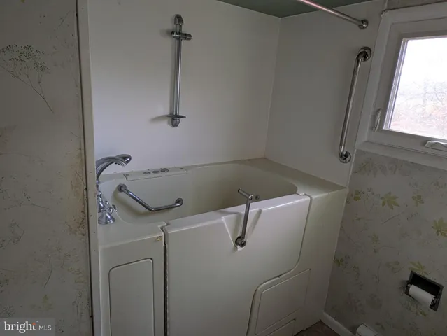 a bathroom with a sink and tub