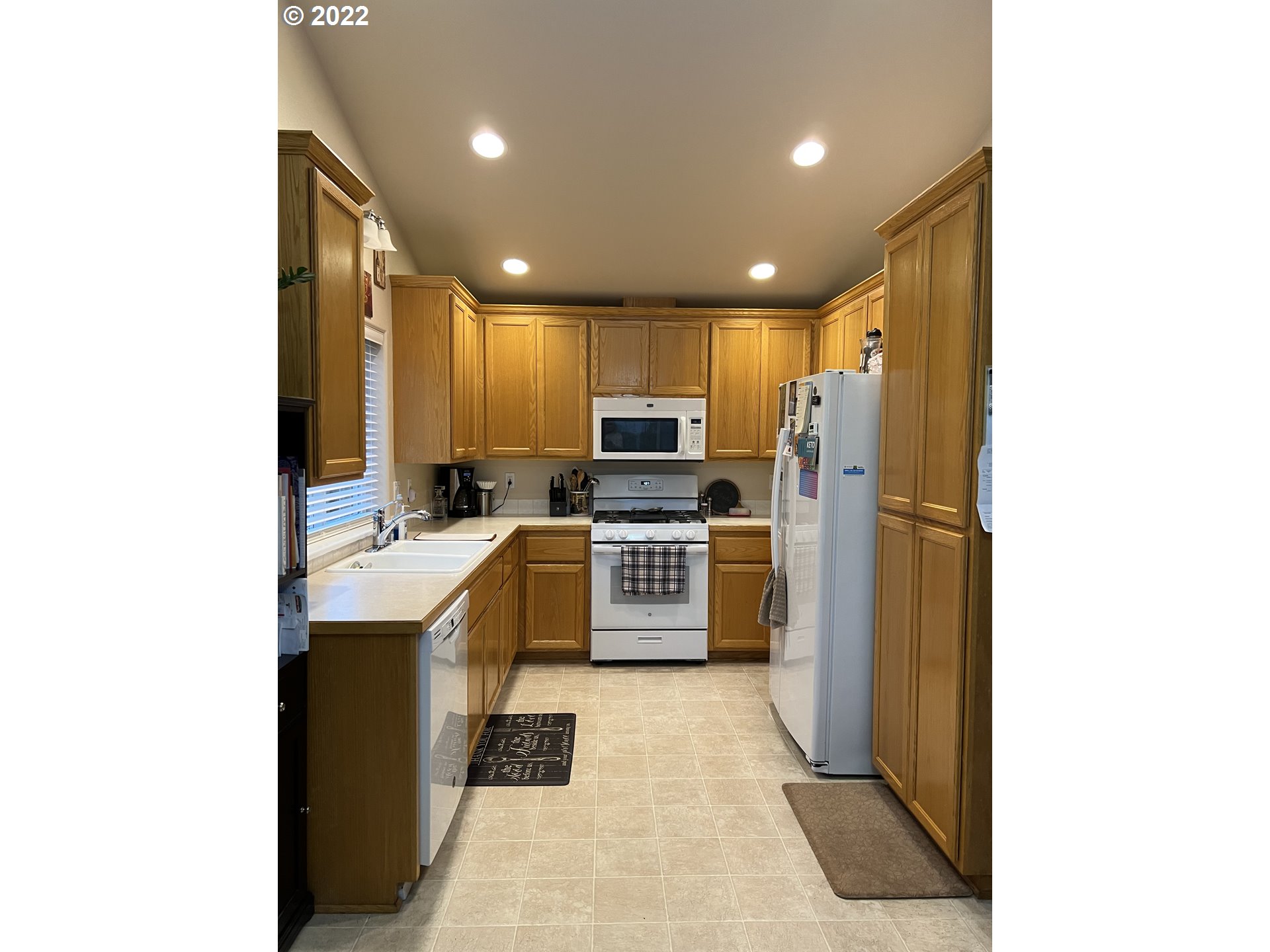 6073 Pine Ridge Place Eugene, OR 97402 - Photo 2 of 18 a large kitchen with stainless steel appliances granite countertop a refrigerator and a stove