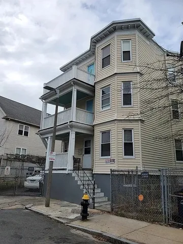 a front view of a house with parking