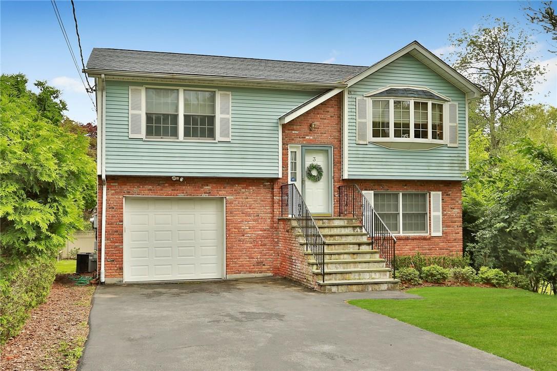3 Charles Street Valhalla, NY 10595 - Photo 1 of 1 a front view of a house with a garden and yard