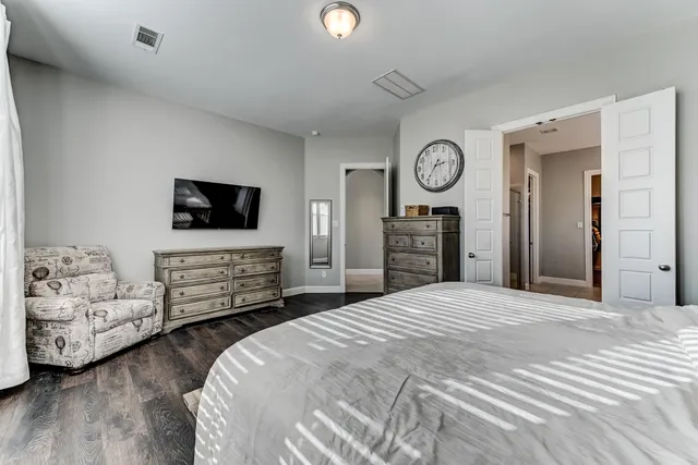 a bedroom with bed and tv