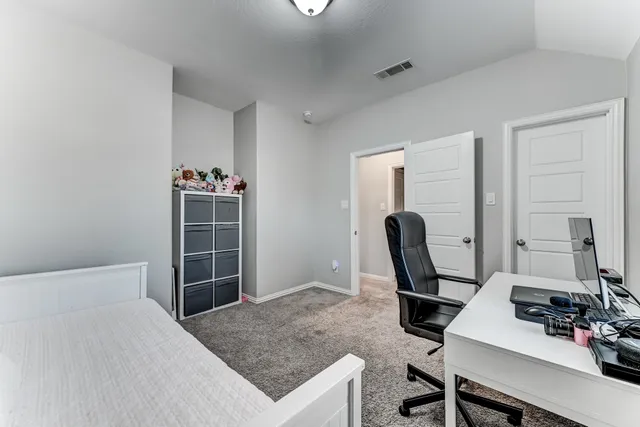 a workspace with furniture and window