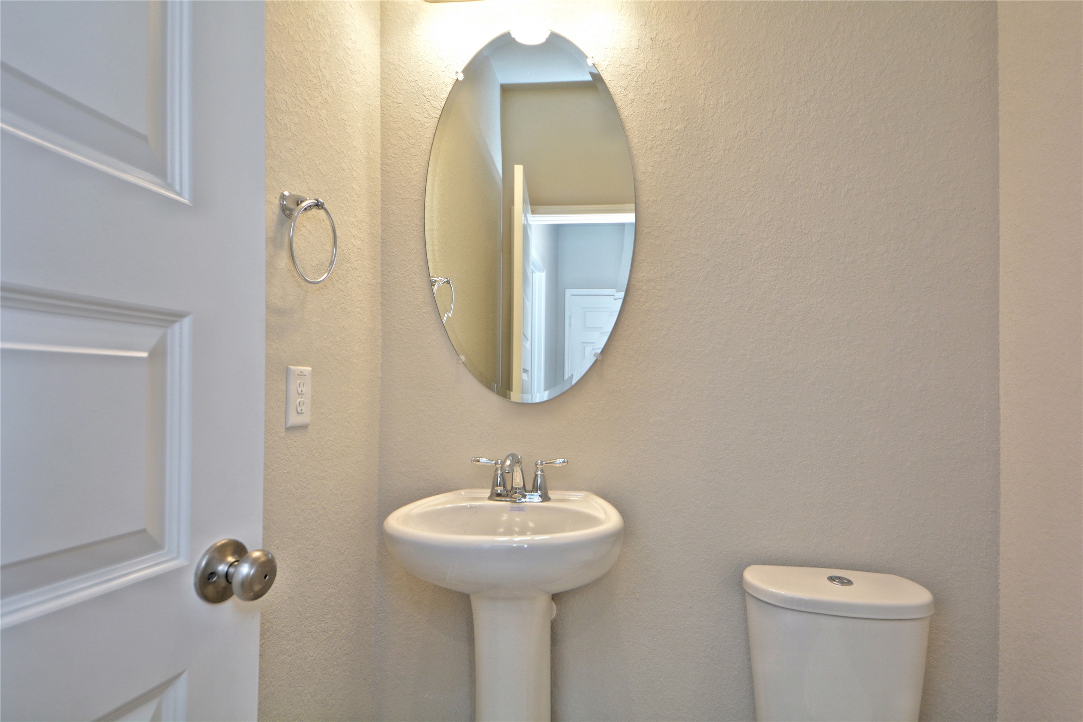1015 Modesto Drive Rosharon, TX 77583 - Photo 23 of 37 Convenient guest powder room featuring a pedestal sink and clean finishes, perfect for visitors! A great added feature for functionality and comfort. Make this home yours today!