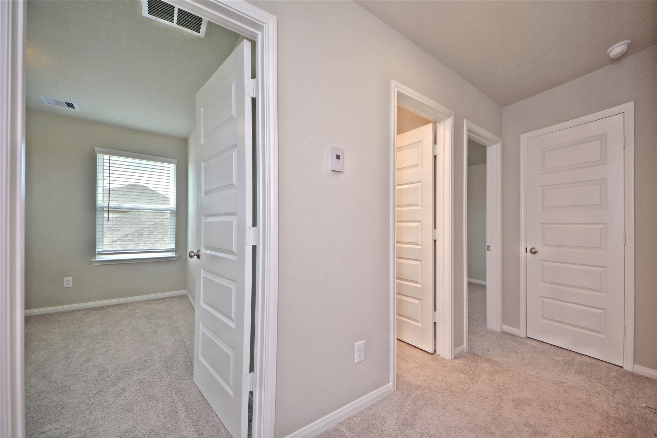 1015 Modesto Drive Rosharon, TX 77583 - Photo 27 of 37 Well designed upstairs hallway leading to multiple bedrooms and bath areas, offering privacy and convenience for family or guests! Thoughtful layout makes this home both functional and inviting. CALL NOW and make this home yours!