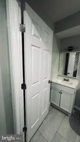 a bathroom with a sink and mirror