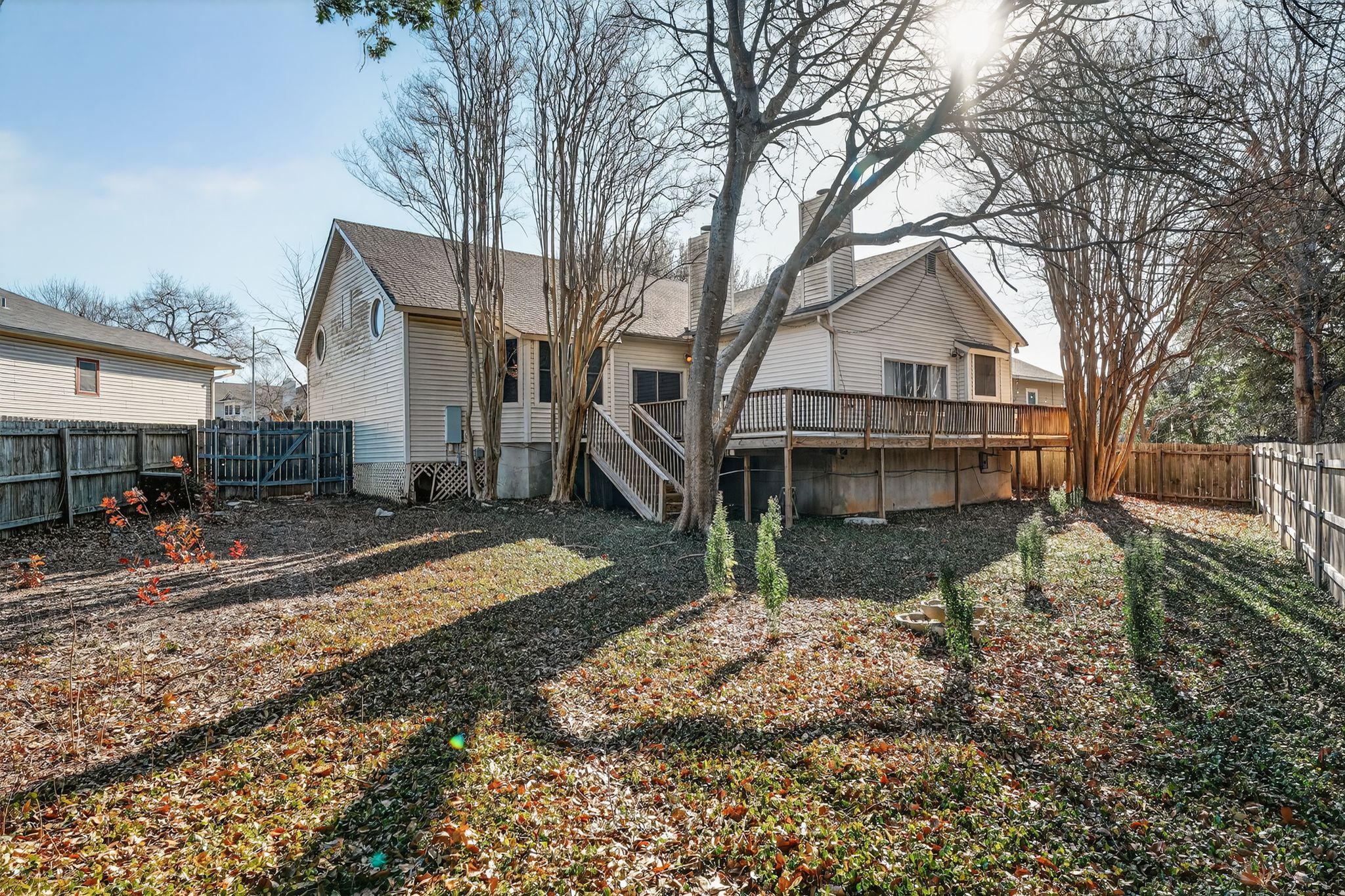 2113 Cervin Boulevard Austin, TX 78728 - Photo 5 of 27 Back of property featuring a fenced backyard and a wooden deck