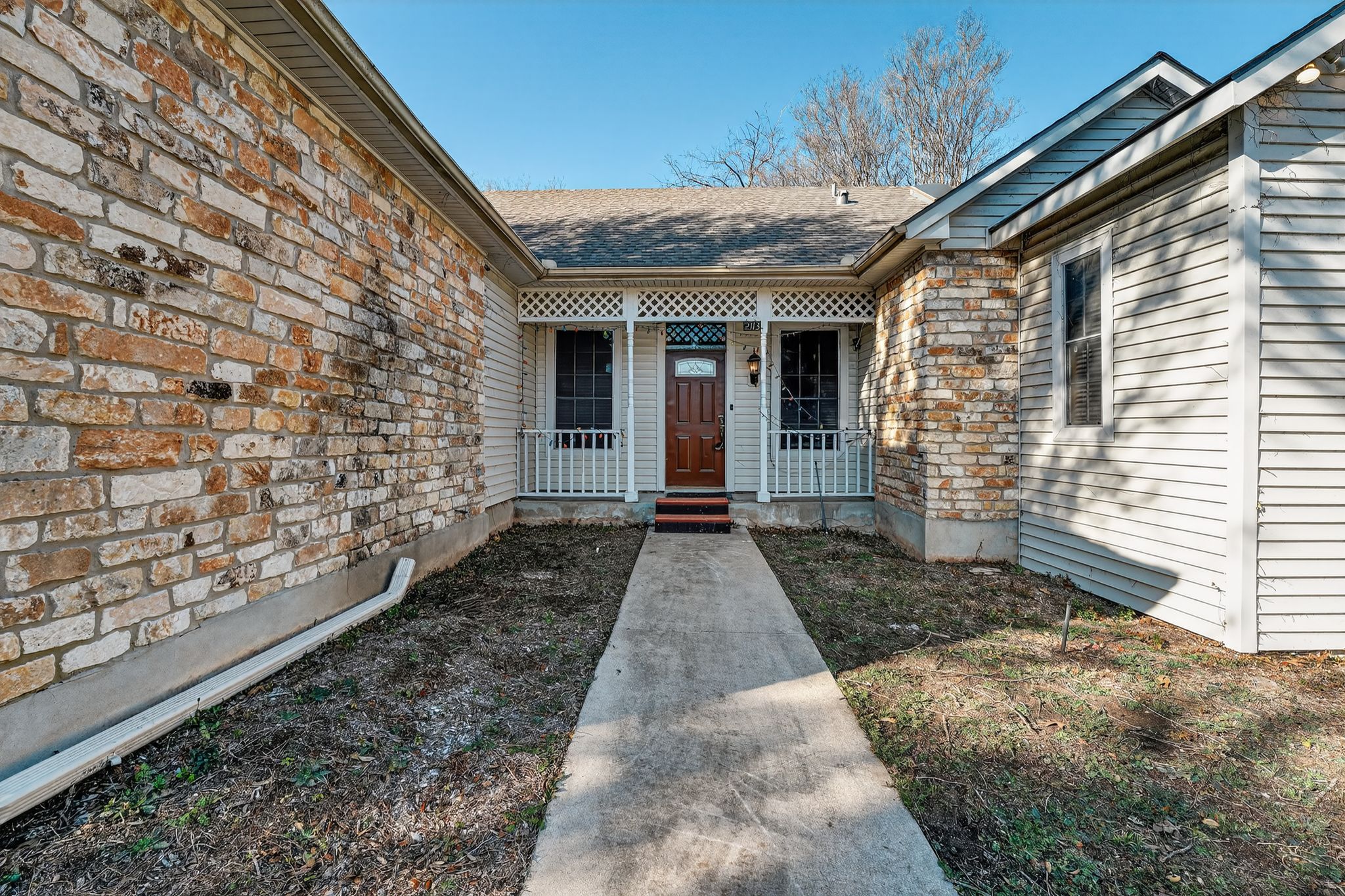 2113 Cervin Boulevard Austin, TX 78728 - Photo 7 of 27 Property entrance featuring a porch and stone siding