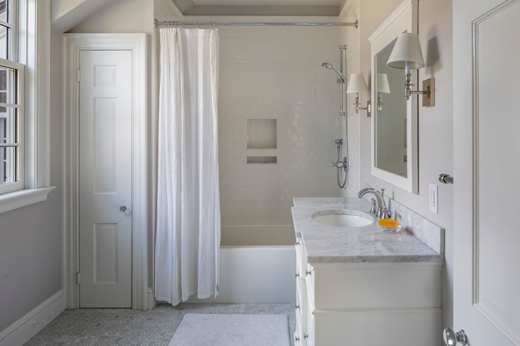 401 Sandy Valley Road Westwood, MA 02090 - Photo 15 of 26 a bathroom with a granite countertop sink and a mirror