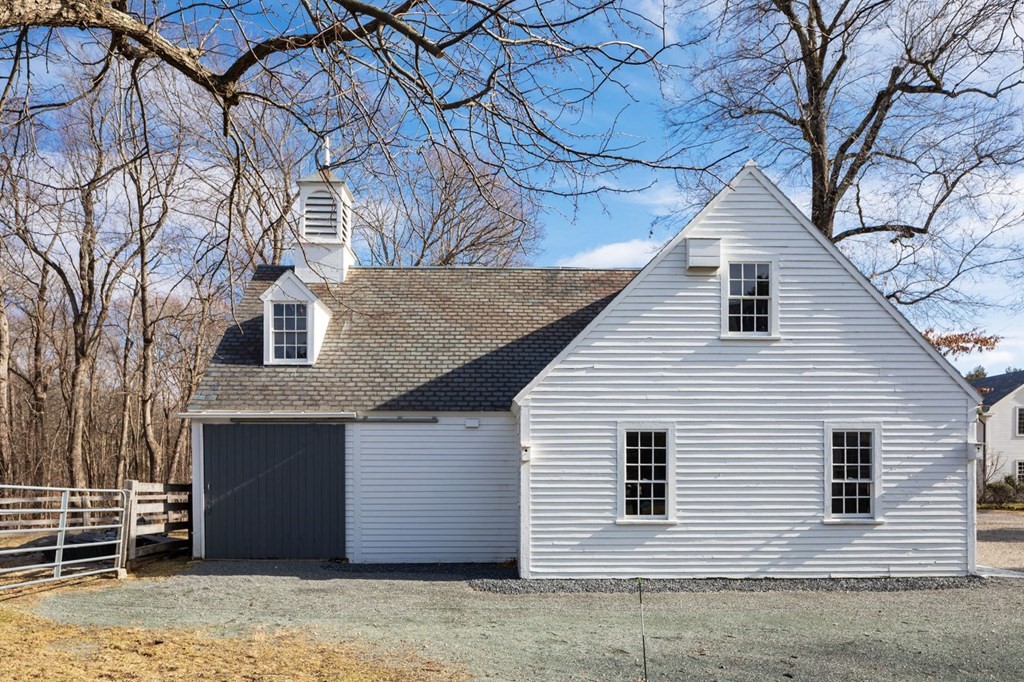 401 Sandy Valley Road Westwood, MA 02090 - Photo 22 of 26 a front view of a house with parking
