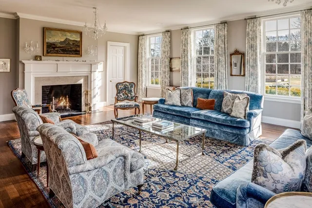a living room with furniture fireplace and flat screen tv