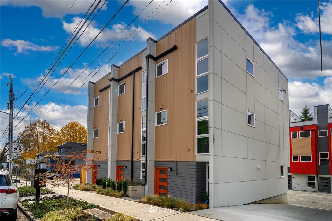 a view of street with small buildings