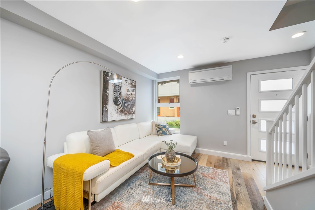 423 Martin Luther King Jr Way South, Unit A Seattle, WA 98144 - Photo 11 of 31 a living room with furniture and a wooden floor