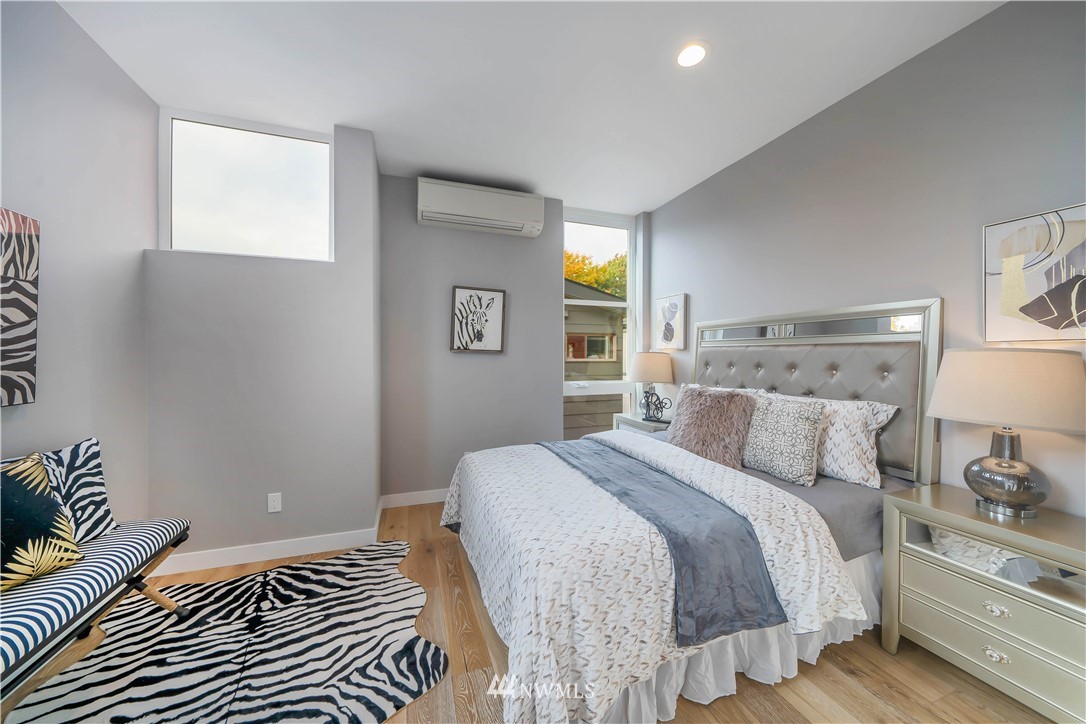 423 Martin Luther King Jr Way South, Unit A Seattle, WA 98144 - Photo 19 of 31 a bedroom with a bed and a window