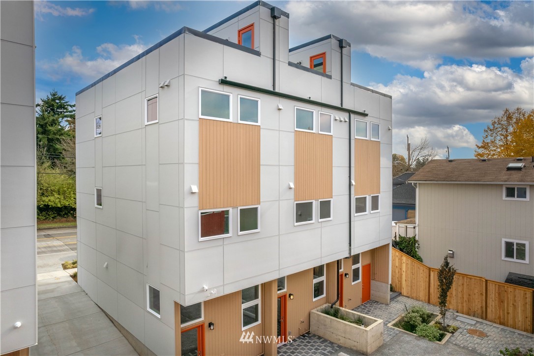 423 Martin Luther King Jr Way South, Unit A Seattle, WA 98144 - Photo 3 of 31 a view of a blue house with large windows
