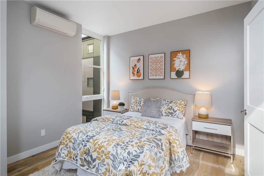 423 Martin Luther King Jr Way South, Unit A Seattle, WA 98144 - Photo 24 of 31 a bedroom with a bed and a window