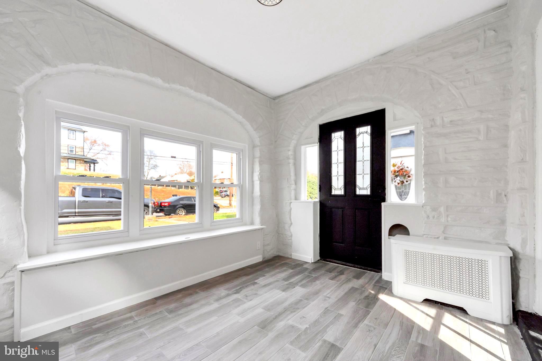 4938 State Road Drexel Hill, PA 19026 - Photo 12 of 38 a view of an empty room with a window and a kitchen