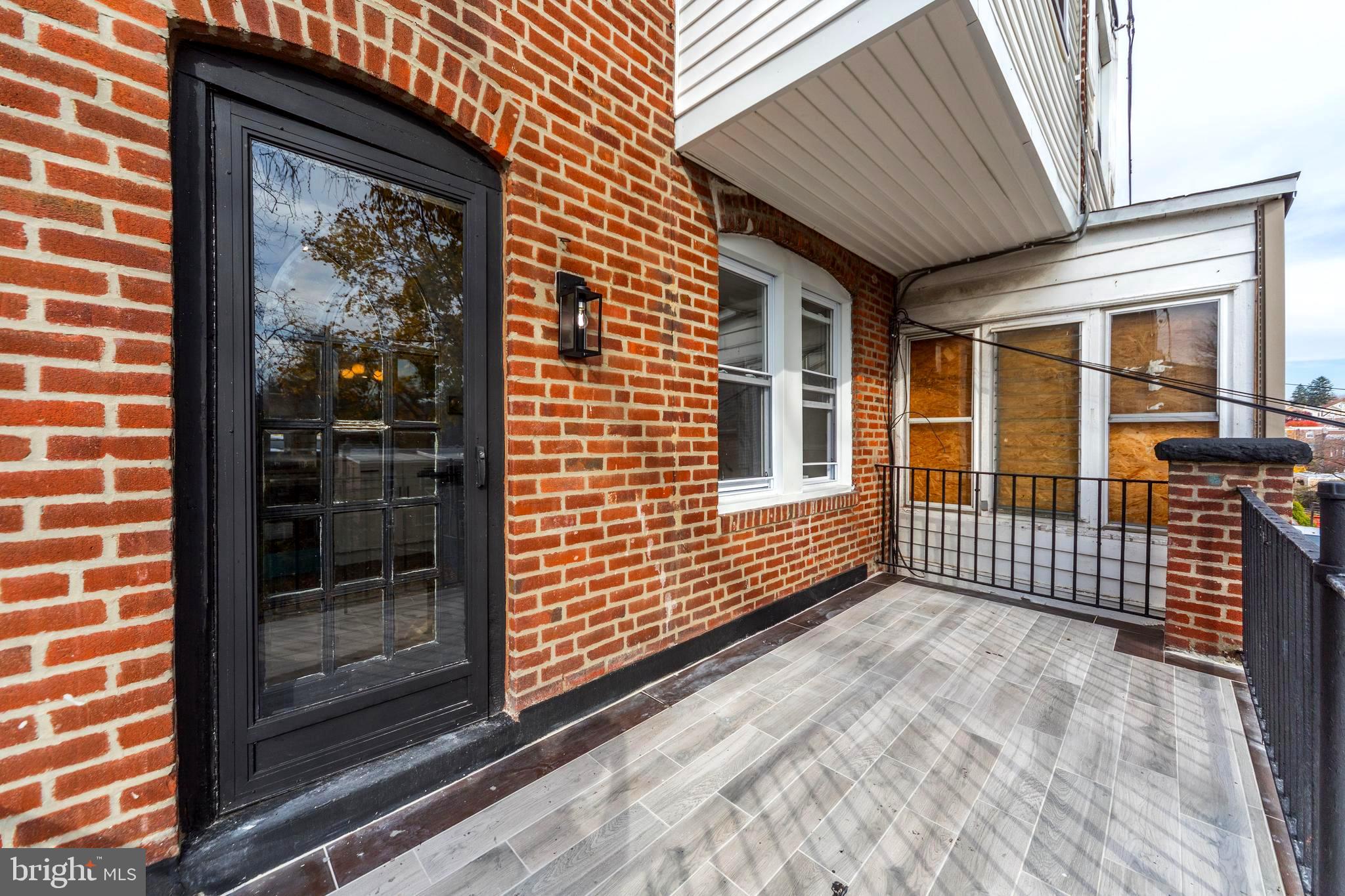 4938 State Road Drexel Hill, PA 19026 - Photo 14 of 38 a view of a porch with a door and wooden floor