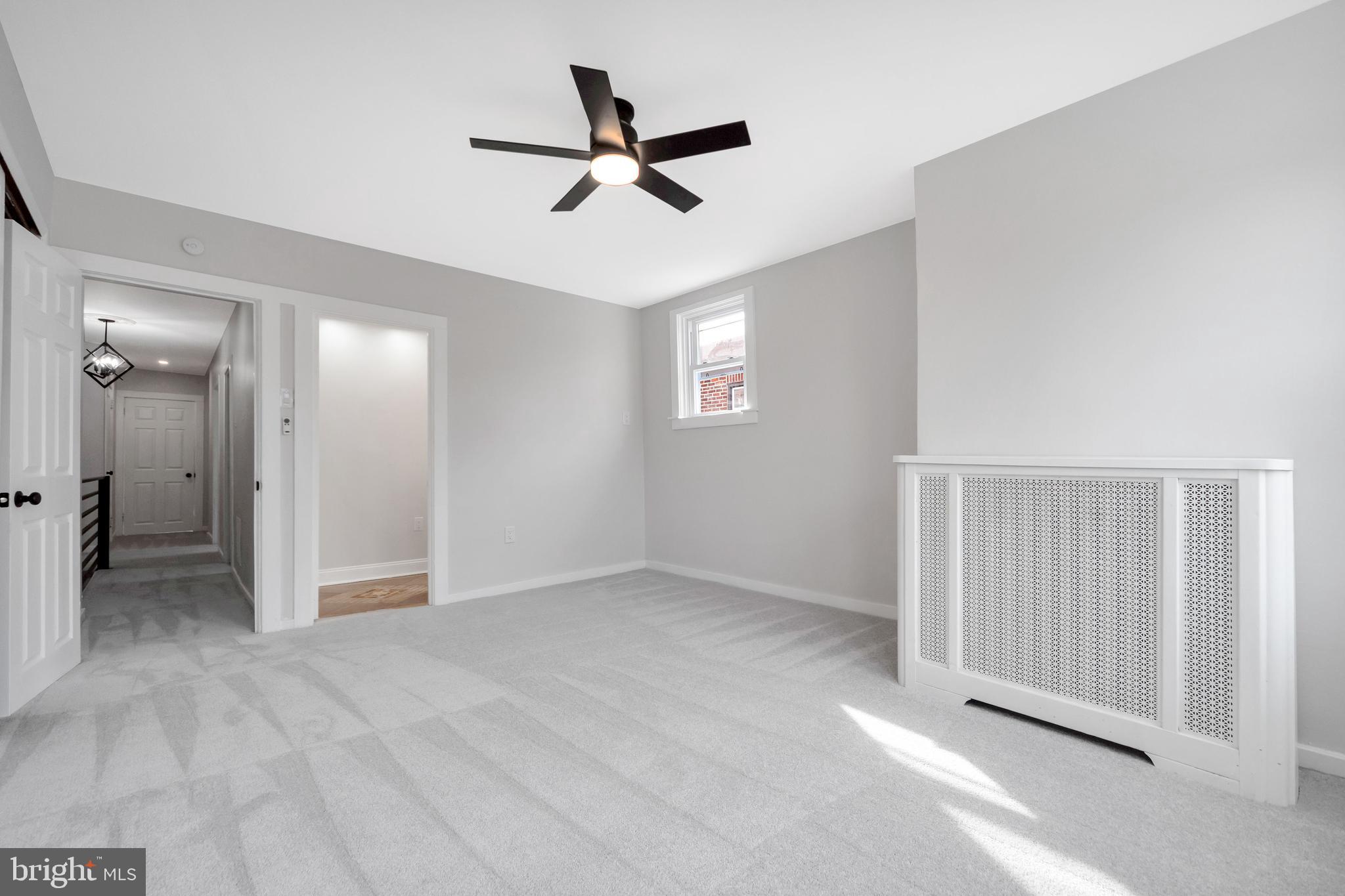 4938 State Road Drexel Hill, PA 19026 - Photo 26 of 38 an empty room with a ceiling fan and window