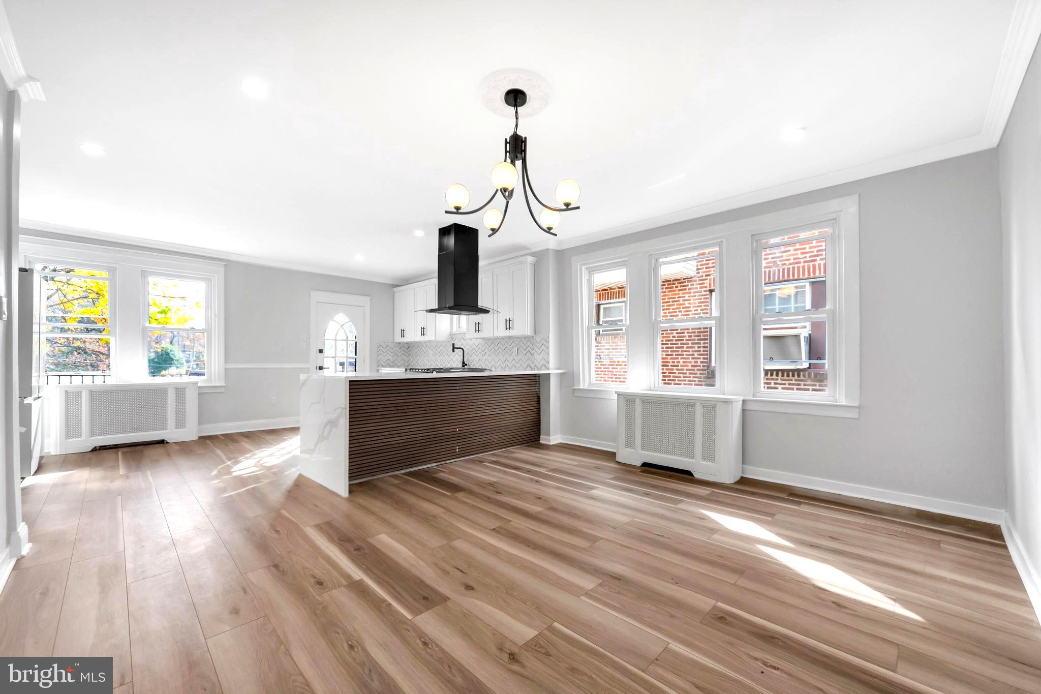 4938 State Road Drexel Hill, PA 19026 - Photo 7 of 38 a living room with kitchen island furniture and a window