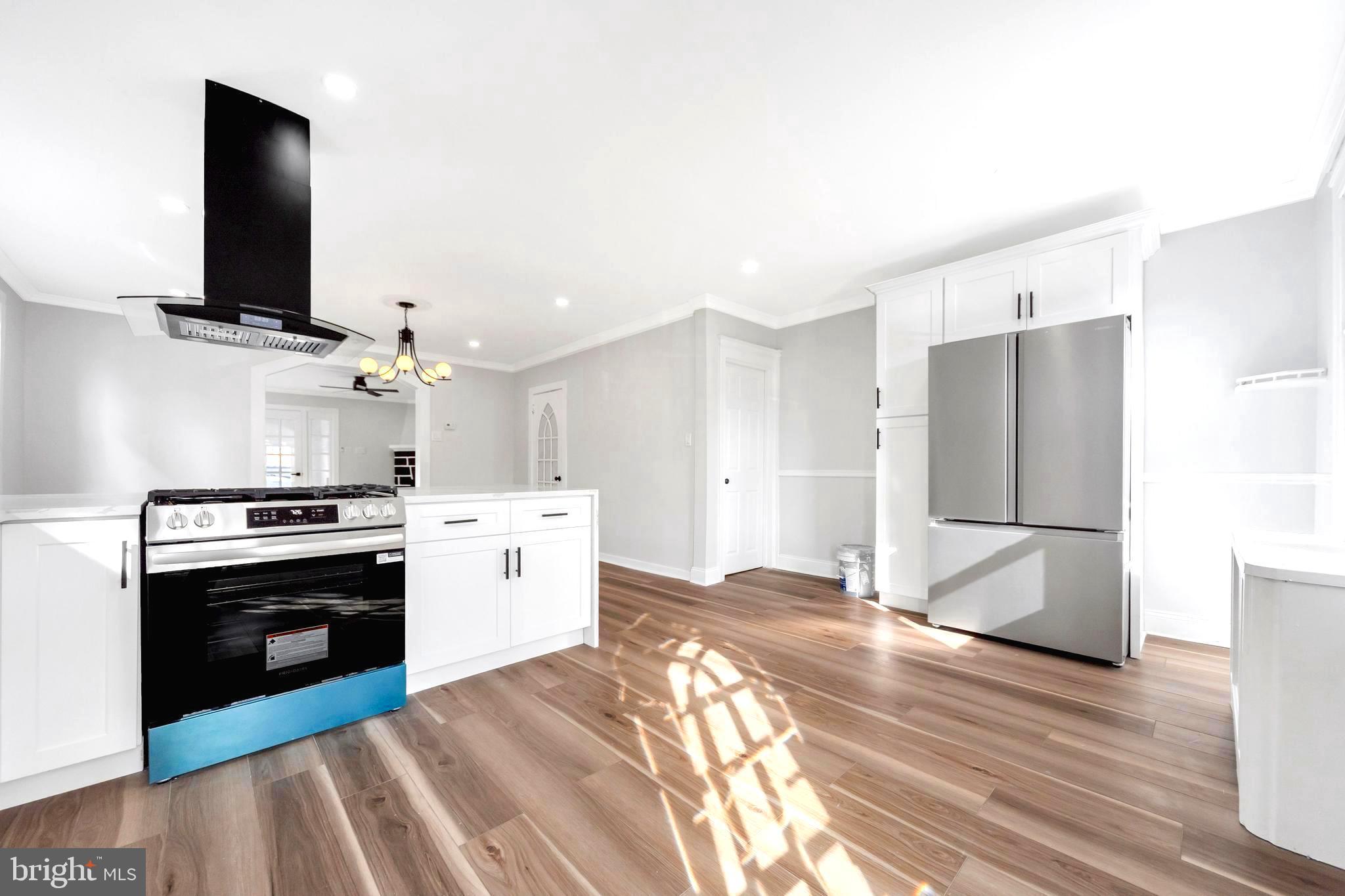 4938 State Road Drexel Hill, PA 19026 - Photo 9 of 38 a kitchen with a stove and a refrigerator
