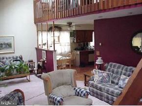1913 Whitcomb Road Forked River, NJ 08731 - Photo 2 of 6 a living room with furniture and a fireplace