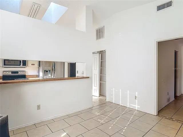 a view of an empty room with a window