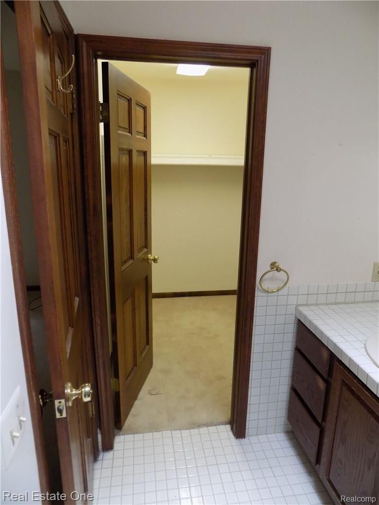 4650 Clyde Road Holly, MI 48442 - Photo 42 of 68 Master suite walk-in closet off the master bath