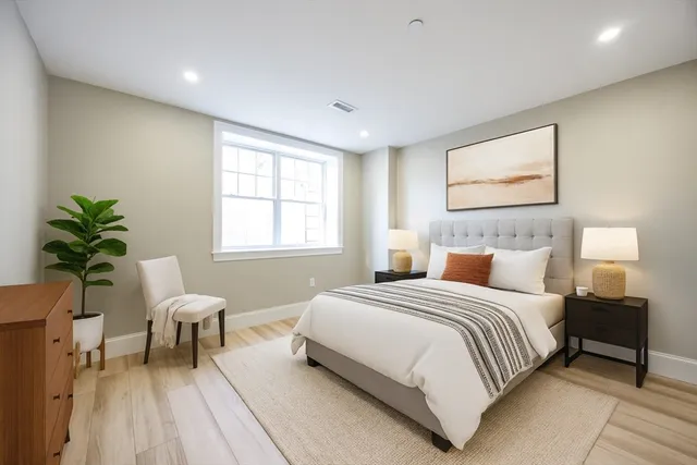 a bedroom with a bed and a couch