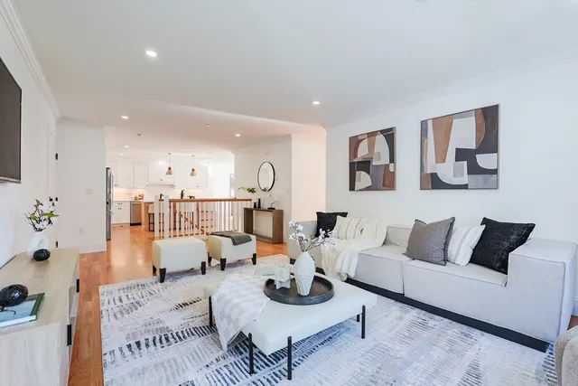 a living room with furniture and a rug