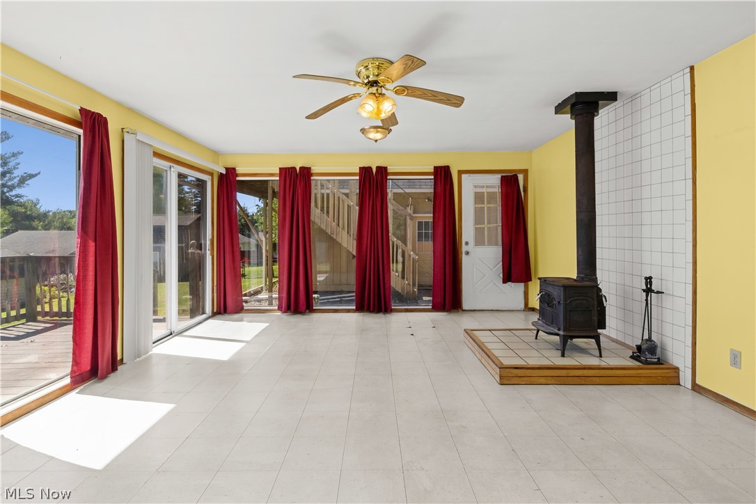 409 Edith Avenue Akron, OH 44312 - Photo 9 of 45 Spacious room featuring multiple sliding glass doors and a single exterior door