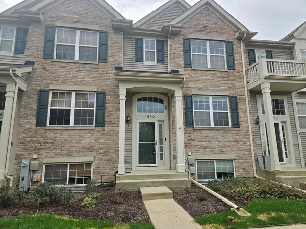 a front view of a house with yard