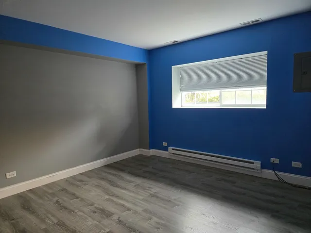 a view of an empty room and a window