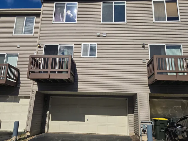 a view of a house with wooden deck