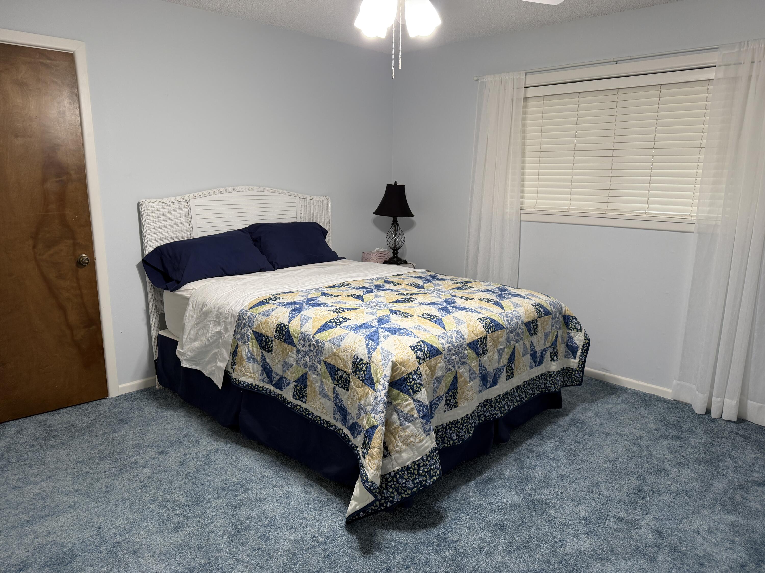 1603 South 8th Street Lamesa, TX 79331 - Photo 11 of 39 a bedroom with a bed and window