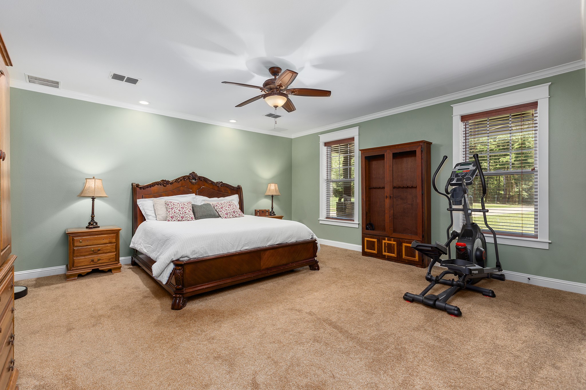 5848 Fm 1751 Bronson, TX 75930 - Photo 23 of 50 a bedroom with a bed a gym equipment and a large window