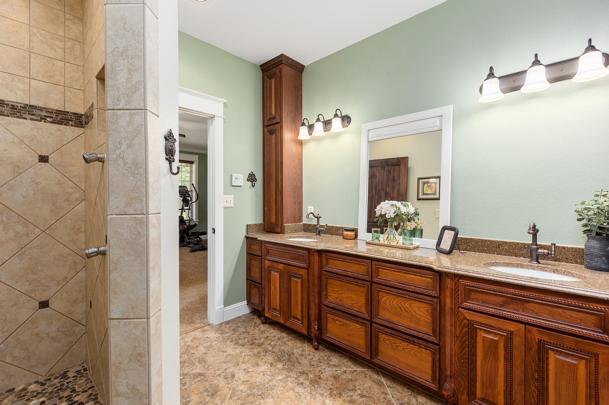 5848 Fm 1751 Bronson, TX 75930 - Photo 27 of 50 a bathroom with a double vanity sink and mirror with shower