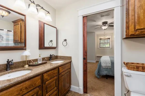 a en suite bathroom with a sink and a mirror