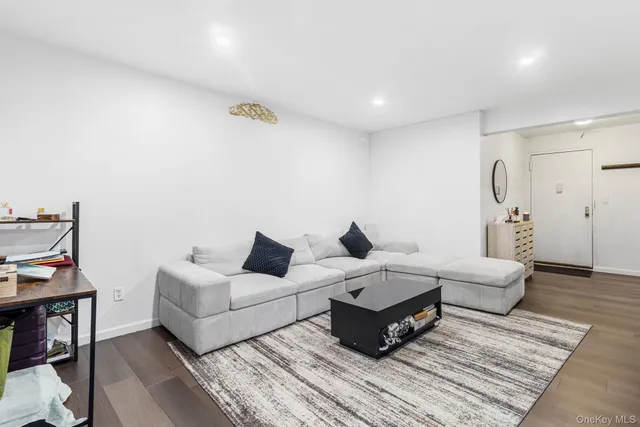 a living room with furniture and a rug