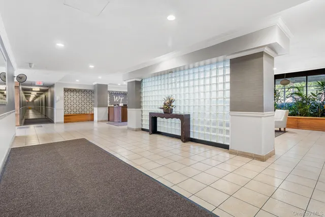 a lobby with furniture and window